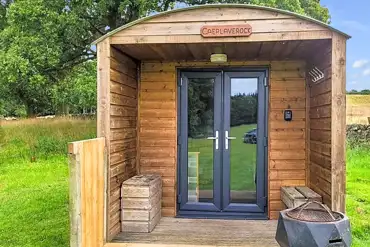 Bunkbed camping pod with a small deck area at Hensol Estate Holidays