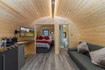Carrock View Glamping Pod with a double bed, kitchenette, and lounge area