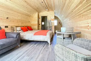 Carrock Squirrel Glamping Pod king-sized bedroom area