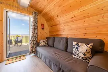 Glamping pod double sofa bed for kids, with two sleeping bags provided Glamping pod double sofa bed for kids, with two sleeping bags provided