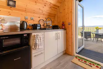 Kitchenette with hob, fridge, microwave, toaster, kettle, crockery and utensils Kitchenette with hob, fridge, microwave, toaster, kettle, crockery and utensils