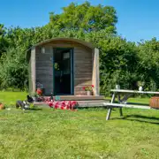 Furnished camping pods exterior with a picnic bench (dog friendly)
