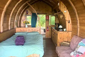 Glamping pod interior with double bed