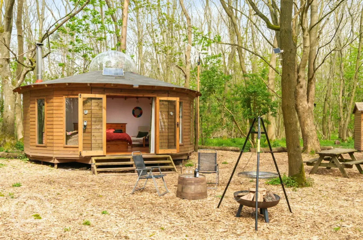 Roundhouse wooden yurt with fire pit