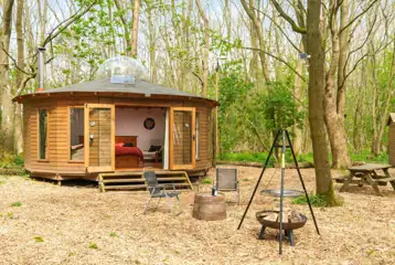 Roundhouse wooden yurt with fire pit