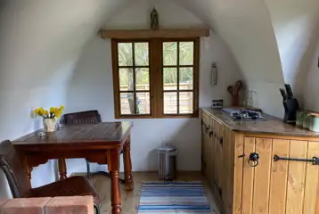 Glamping shepherd's hut kitchen and dining area