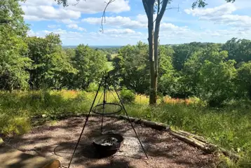 Glamping pod with outdoor fire pit area
