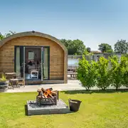 Ensuite glamping pod exterior with fire pits (four persons) Ensuite glamping pod exterior with fire pits (four persons)