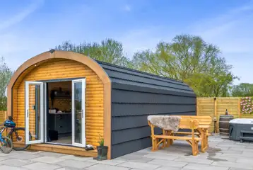 Glamping pod with an electric hot tub at Dwell On The Moor