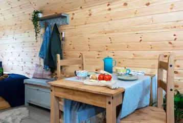 Glamping pod with hot tub dining area