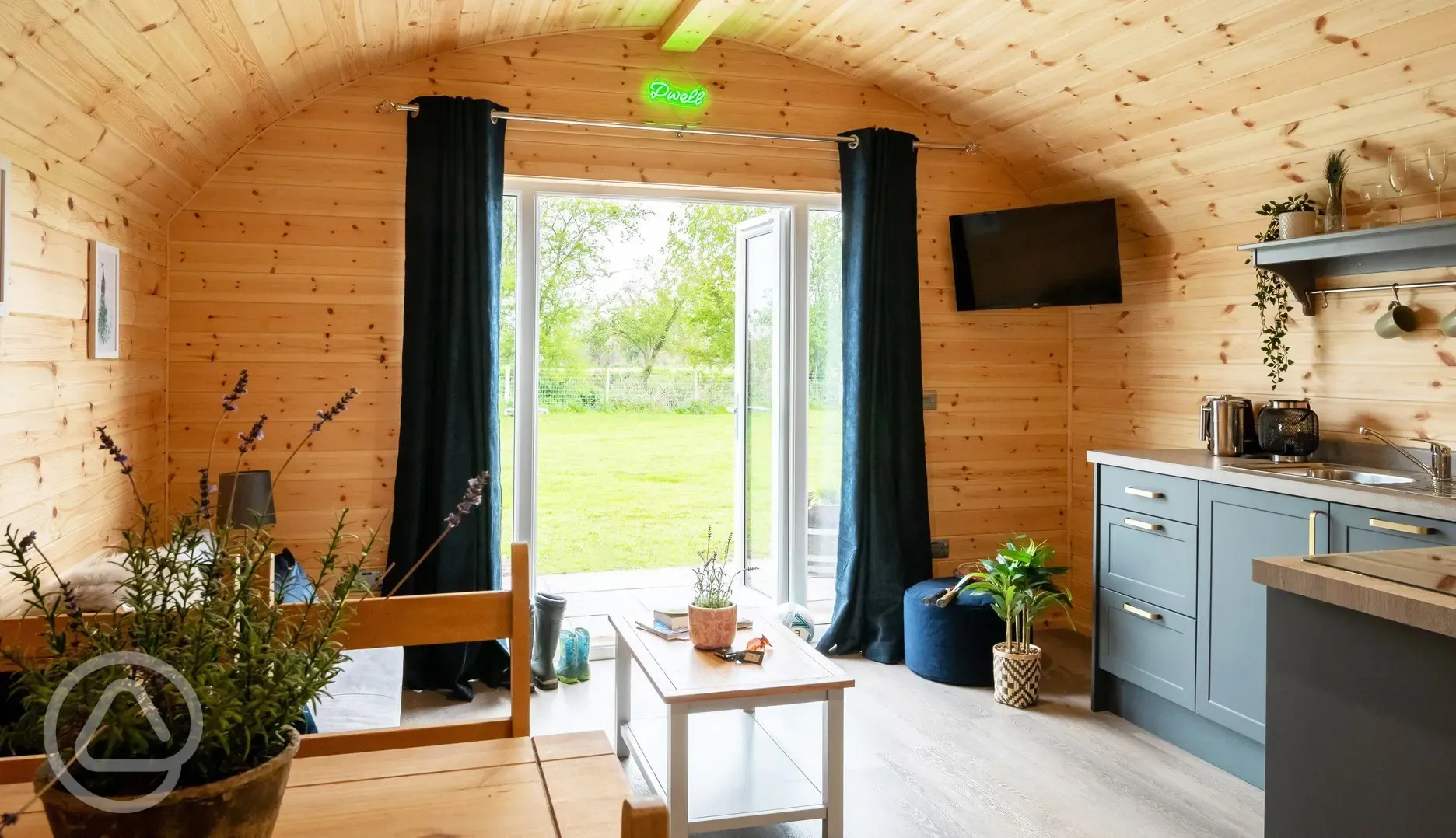 Glamping pod with hot tub living area