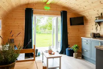 Glamping pod with hot tub living area