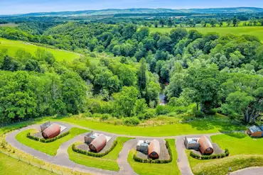 Aerial of the ensuite glamping pods with private hot tubs at Peel Farm