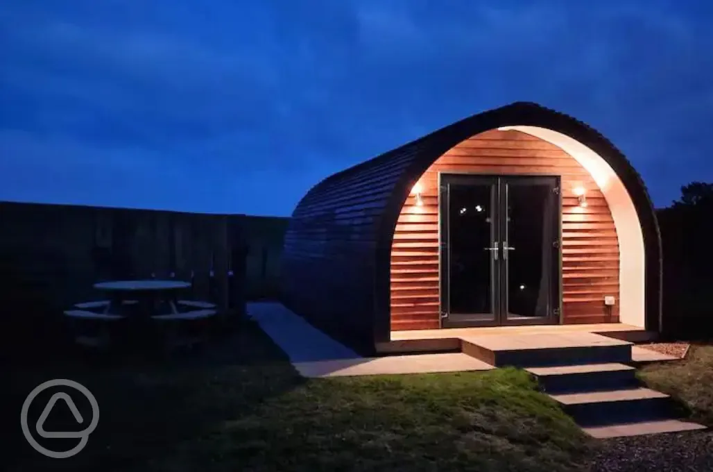 Ensuite glamping pods at night