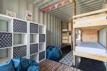 Glamping cabin interior with bunks beds and storage Glamping cabin interior with bunks beds and storage