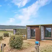 Glamping cabins with fencing between