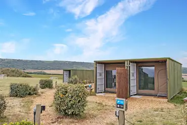 Glamping cabins with fencing between