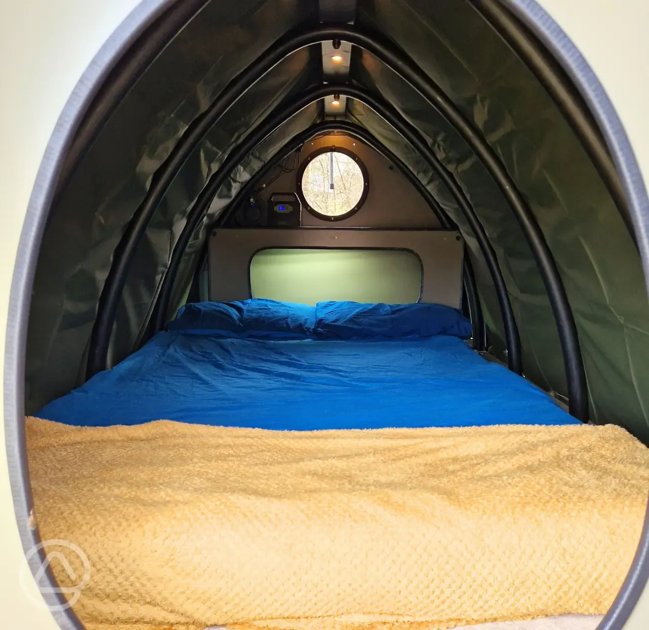 The double bed inside the Lil' Cockup small Landpod (bedding included)