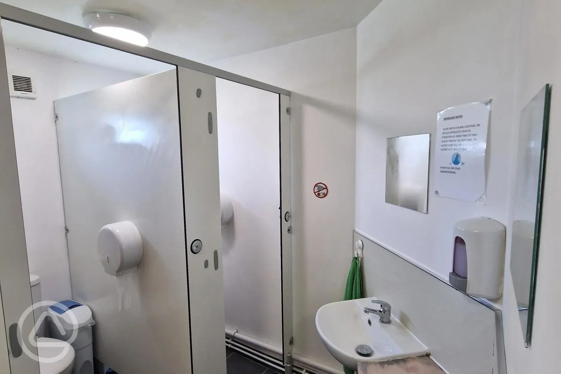 Two toilets and two sinks at Kestrel Lodge
