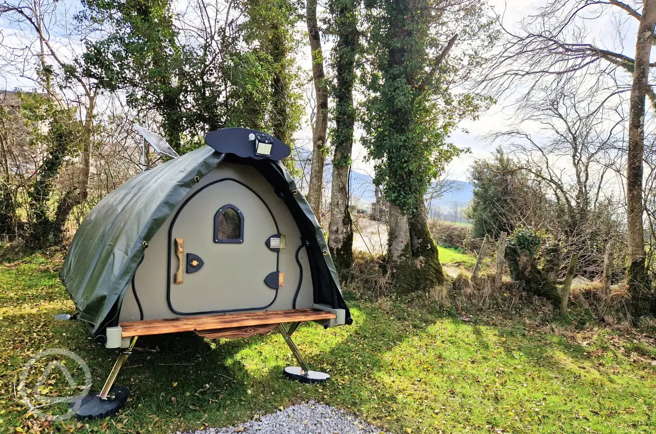  Insulated Lil' Cockup small Landpod surrounded by trees and woodland