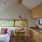 The Boat Shed double day bed and kitchen area