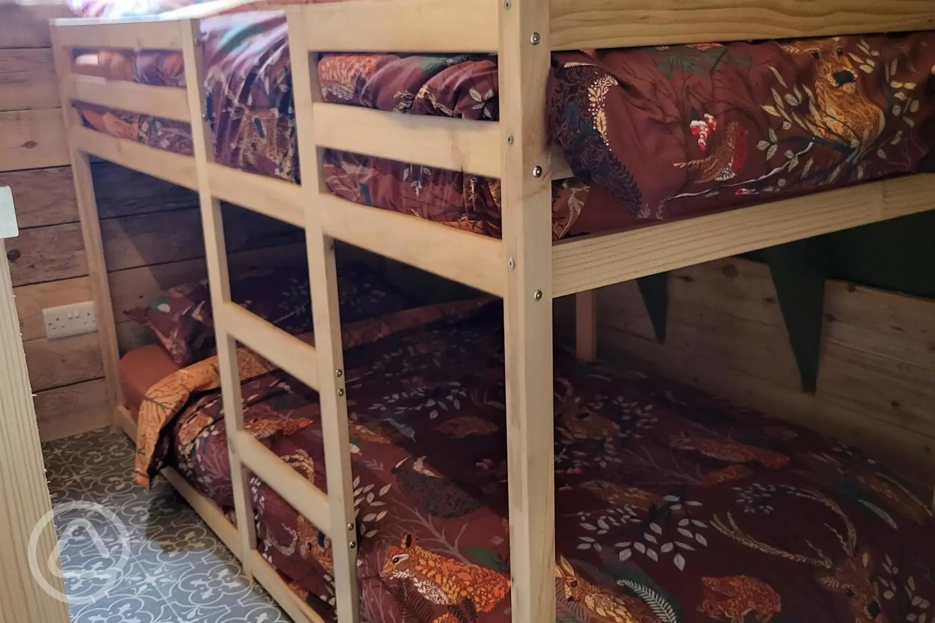 Six person glamping cabin bunk bedroom