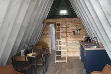 Six person glamping cabin open living space Six person glamping cabin open living space