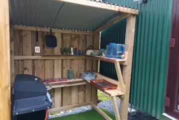 Glamping cabin outdoor cooking area Glamping cabin outdoor cooking area