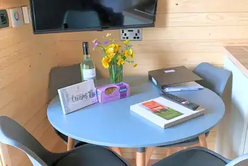 Glamping pod dining area and TV