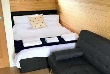 Glamping pod double bed and double sofa bed for kids