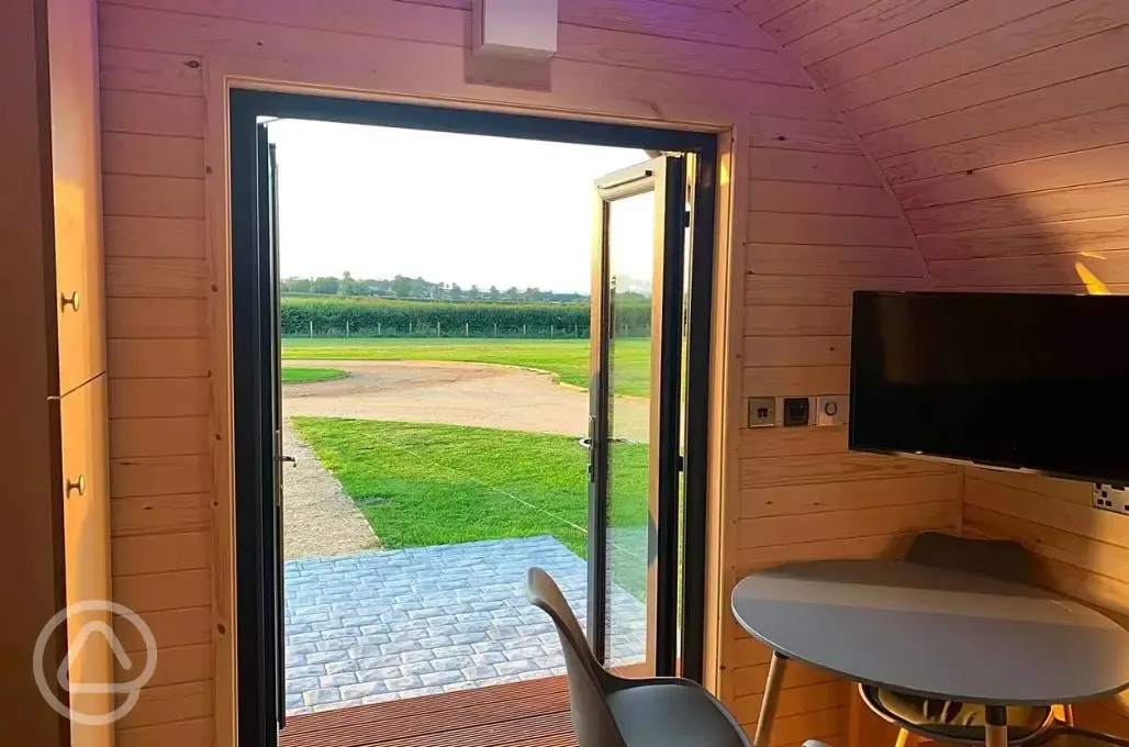 Glamping pod dining area, TV and views