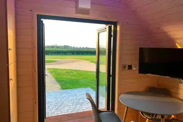 Glamping pod dining area, TV and views