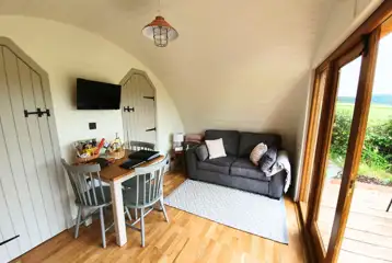 Towy glamping pod interior and sofa Towy glamping pod interior and sofa
