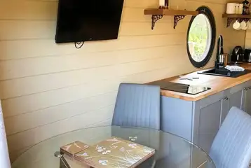 Teilo glamping pod dining area and TV Teilo glamping pod dining area and TV