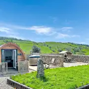 Glamping pod with hot tub and private seating area