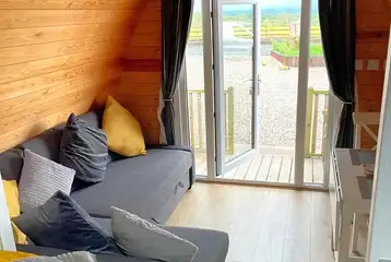 Glamping pod sofa bed with views of the Cumbrian countryside Glamping pod sofa bed with views of the Cumbrian countryside