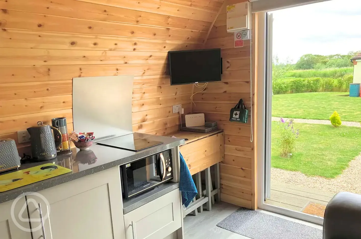 Seadreams glamping pod kitchen and TV