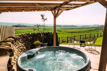Private patios with hot tubs and cocoon swing chairs