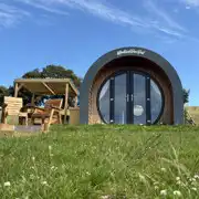 Glamping pod interior with a double bed and double sofa bed Glamping pod interior with a double bed and double sofa bed
