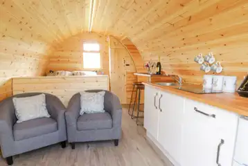 Embden glamping pod kitchenette and view towards the bed area Embden glamping pod kitchenette and view towards the bed area