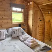 Ensuite Embden glamping pod interior (bedding included) at Banwy Glamping Ensuite Embden glamping pod interior (bedding included) at Banwy Glamping