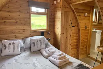 Ensuite Embden glamping pod interior (bedding included) at Banwy Glamping Ensuite Embden glamping pod interior (bedding included) at Banwy Glamping