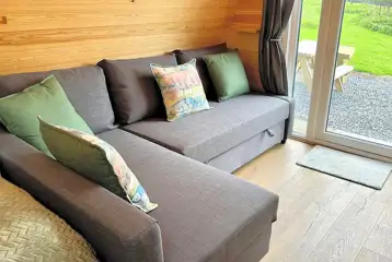 L-shaped sofa bed that folds out to a double bed (bedding provided) L-shaped sofa bed that folds out to a double bed (bedding provided)