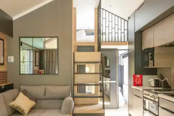 Superior glamping cabin with a double sofa bed and equipped kitchen