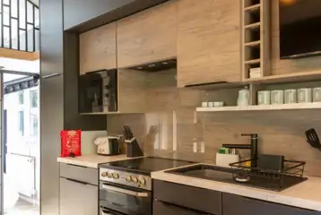 Kitchen with an oven, hob, toaster, fridge, kettle and microwave