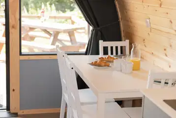 Glamping pod dining area to seat four with a TV Glamping pod dining area to seat four with a TV