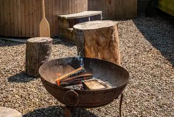 Fire pit area with wooden stool seating