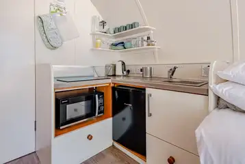 Kitchen with with a sink, kettle, toaster, fridge, freezer, hob and combi oven