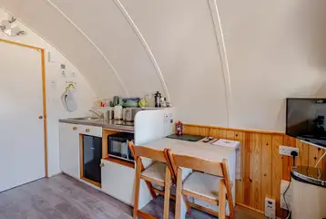 Kitchen with a sink, kettle, toaster, fridge, freezer, hob and combi oven