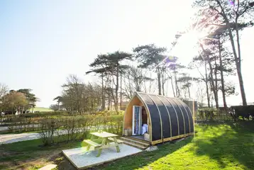 Wooden camping pods with a private picnic bench Wooden camping pods with a private picnic bench